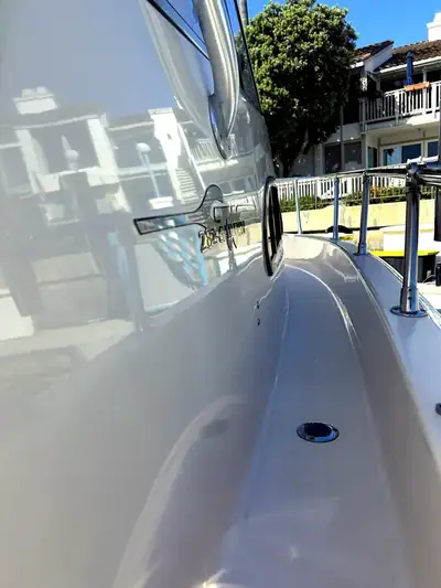 Polished yacht hull reflecting the marina after a HarborSide detail