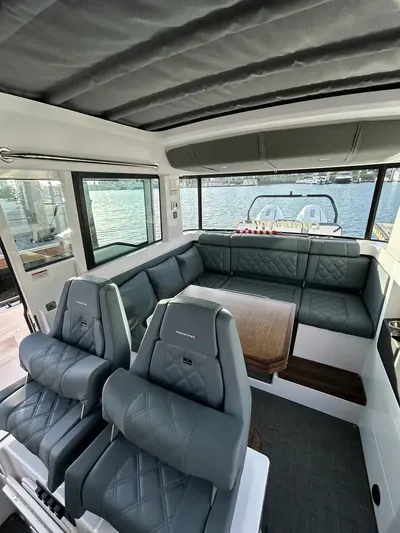 Boat cockpit with grey upholstered seating cleaned and ready