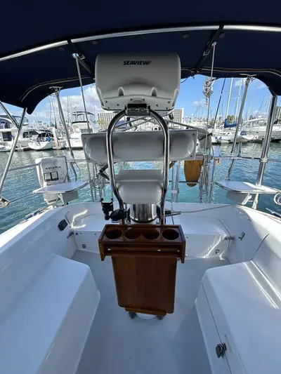 Center-console helm and teak rigging cleaned and ready at the marina