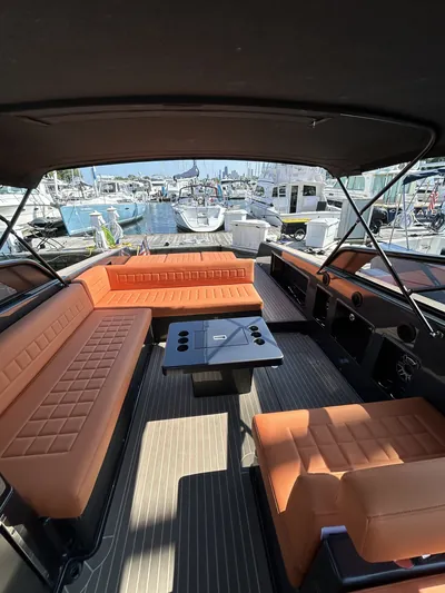 Boat cockpit with cognac leather seating and teak decking after a HarborSide detail