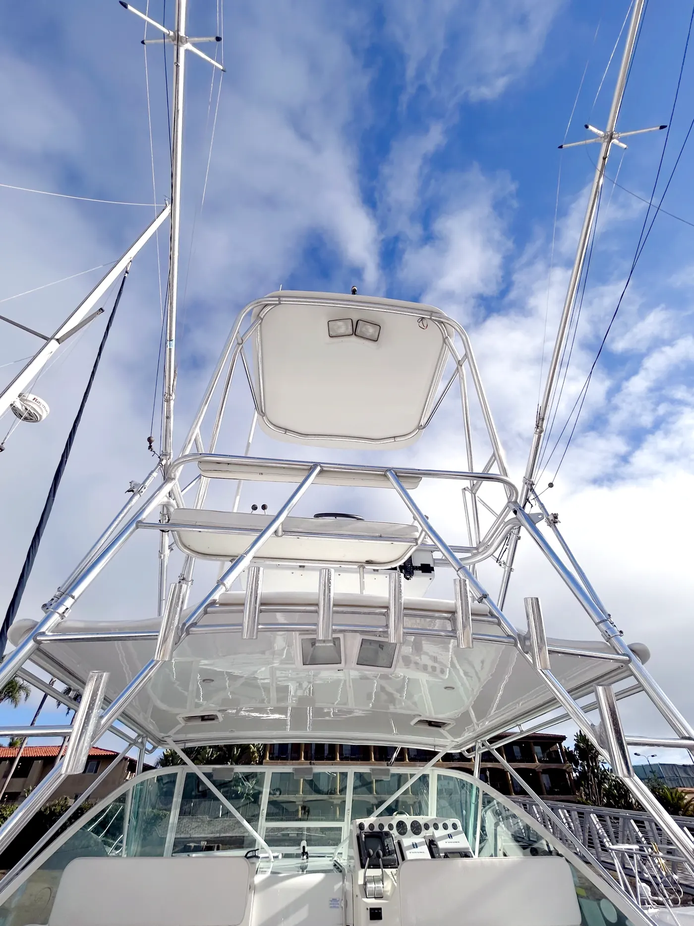 HarborSide technician hand-washing a yacht hull with foamy soap